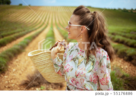 woman in green field in Provence, France looking into distance woman in green field in Provence, France looking into distance 55176886