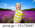 girl in lavender field pointing at something 55176887