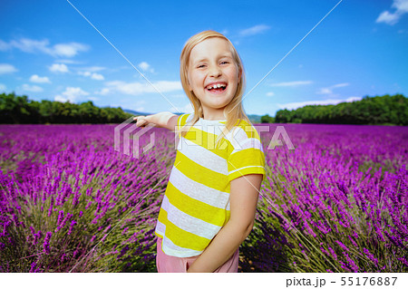 girl in lavender field pointing at something girl in lavender field pointing at something 55176887