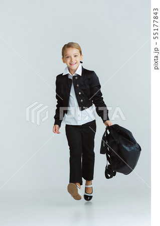Girl preparing for school after a long summer break. Back to school. Girl preparing for school after a long summer break. Back to school. 55177843