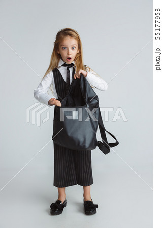 Girl preparing for school after a long summer break. Back to school. Girl preparing for school after a long summer break. Back to school. 55177953