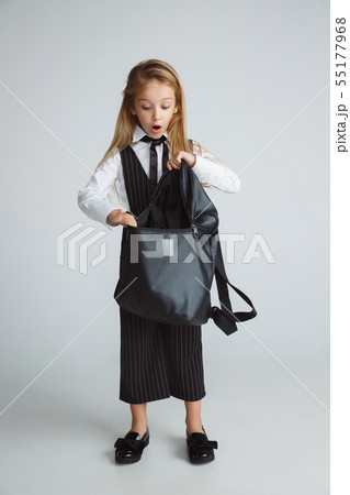 Girl preparing for school after a long summer break. Back to school. 55177968