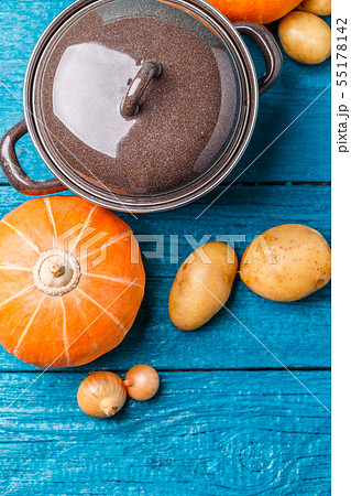 Picture of pot with a lid, potatoes, pumpkin, onions 55178142