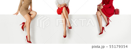 legs woman wearing high heels shoes sitting on bench. legs woman wearing high heels shoes sitting on bench. 55179354