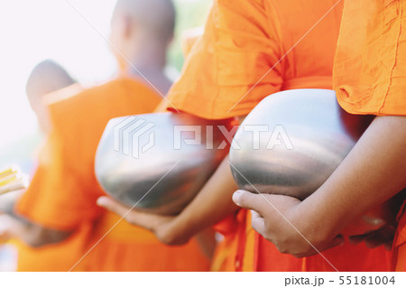 More monks with hand holding give alms bowl More monks with hand holding give alms bowl 55181004