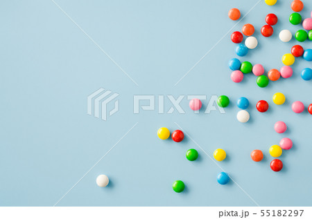 Background of chocolate candy with colored glaze 55182297