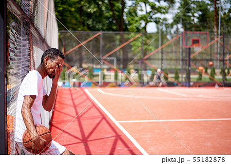 Black basketball player posing in the field Black basketball player posing in the field 55182878