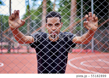 Black basketball player holding the chain link 55182899