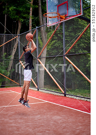 Black basketball player playing in the field 55182912