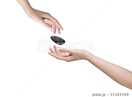 Hand giving and receiving remote car key 55183399