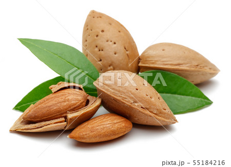 Almonds and green leaves isolated on white Almonds and green leaves isolated on white 55184216