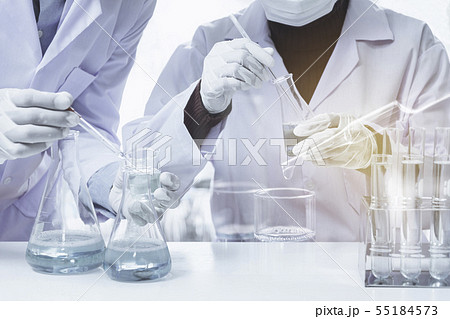 Researcher with glass laboratory chemical test 55184573