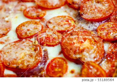 Delicious italian homemade pizza Margarita background. Pizza with tomatoes, mozarella, sausage Delicious italian homemade pizza Margarita background. Pizza with tomatoes, mozarella, sausage 55189564