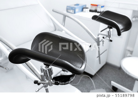 gynecological chair in a light gynecologist's 55189798