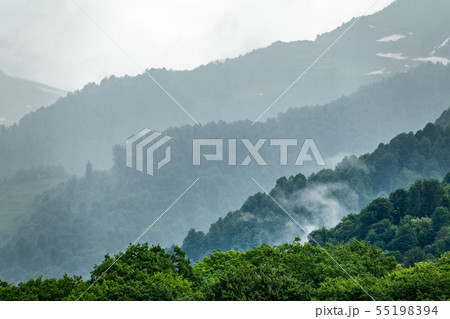 High mountains with forested slopes and peaks High mountains with forested slopes and peaks 55198394