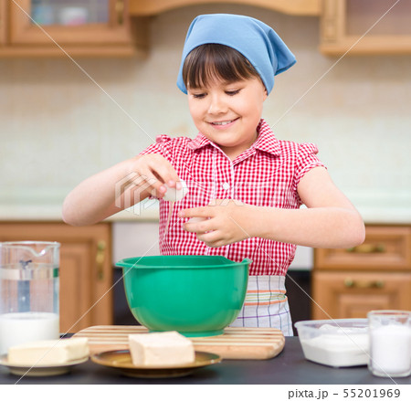 Girl is cooking in kitchen 55201969