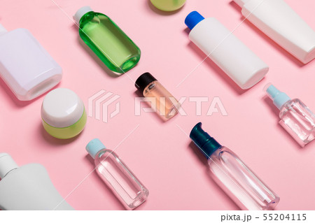 Top view of cosmetic containers, sprays, jars and 55204115