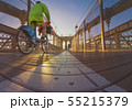 a magnificent view of Brooklyn Bridge with cyclist 55215379