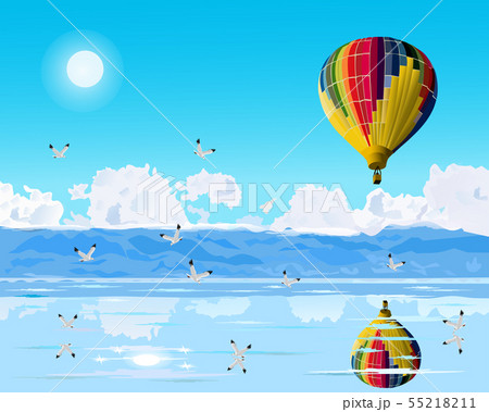 balloons are floating over the blue sea 55218211