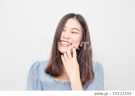 Laughing of beautiful asian women on white Laughing of beautiful asian women on white 55222502