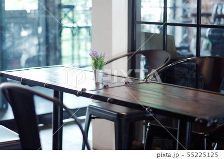 Artificial flowers on the table in the coffee shop 55225125