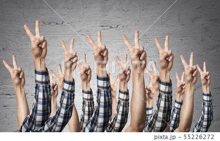 Row of man hands showing victory gesture Row of man hands showing victory gesture 55226272