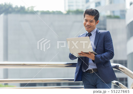 asian businessman portrait with laptop. asian businessman portrait with laptop. 55227665