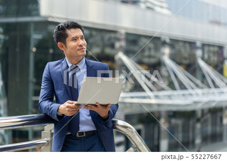 asian businessman portrait with laptop. 55227667
