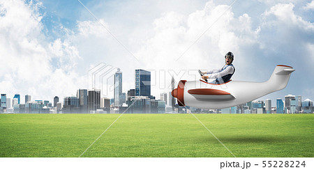 Happy aviator driving small propeller plane Happy aviator driving small propeller plane 55228224