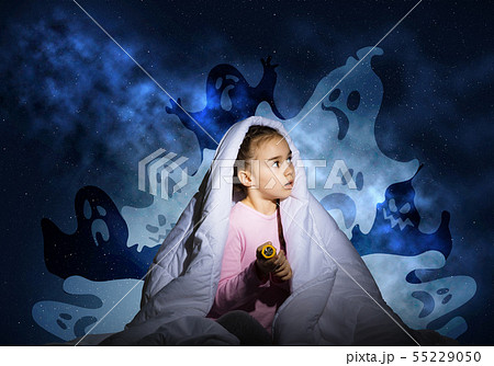 Scared girl with pillow hiding under blanket Scared girl with pillow hiding under blanket 55229050
