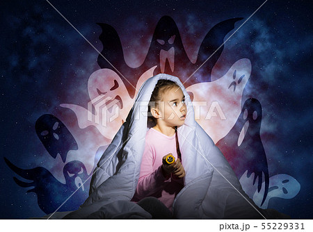 Worried girl hiding under blanket 55229331