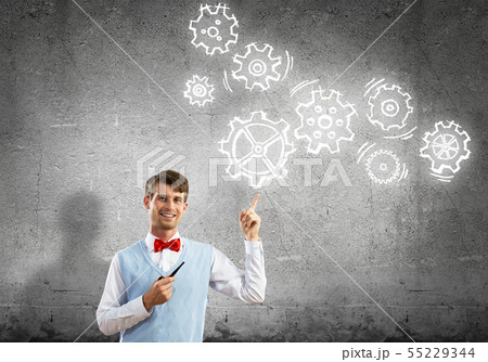 Elegant banker wearing red tie and gears as teamwork concept Elegant banker wearing red tie and gears as teamwork concept 55229344