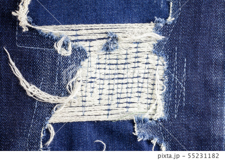 Blue torn denim jeans texture background. Blue torn denim jeans texture background. 55231182