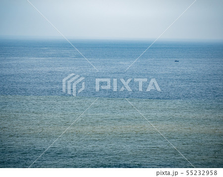 Calm sea surface with boat 55232958