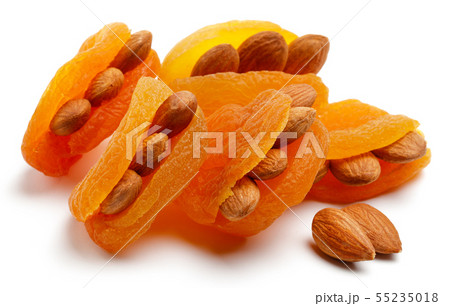 Dried apricots with almonds isolated 55235018