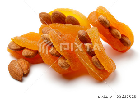 Dried apricots with almonds isolated 55235019