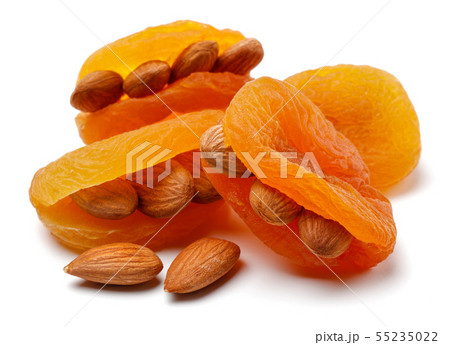 Dried apricots with almonds isolated Dried apricots with almonds isolated 55235022