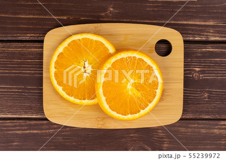 Sweet orange on brown wood 55239972