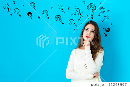 Question marks with young woman 55243997