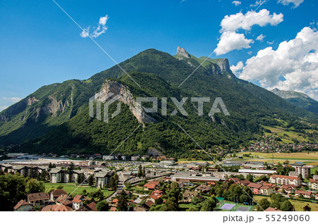 Houses in valley with green mountains and blue sky 55249060