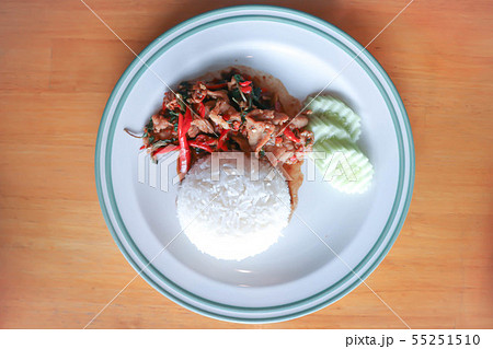 stir-fried pork with fried egg, holy basil and stir-fried pork with fried egg, holy basil and 55251510