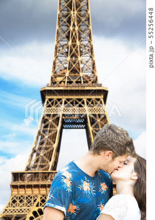 lovers under the Eiffel Tower in Paris 55256448