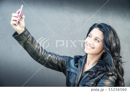 pretty brunette girl take a selfie 55256560