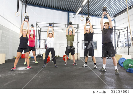 Team workout with kettlebells at fitness gym 55257605