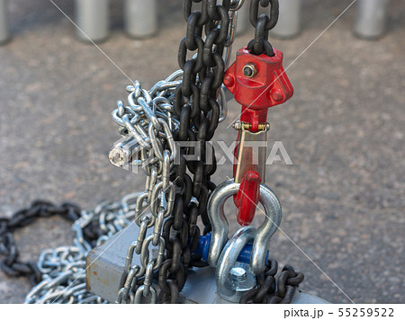 Red chain winch close up sunny day Red chain winch close up sunny day 55259522