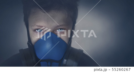 Young boy wearing gasmask, respirator portrait Young boy wearing gasmask, respirator portrait 55260267