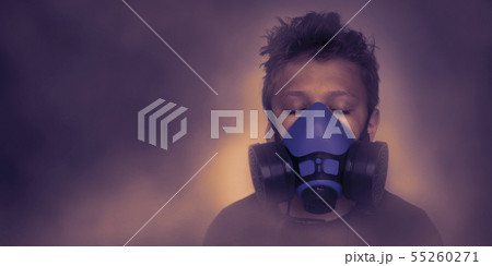 Young boy wearing gasmask, respirator portrait 55260271
