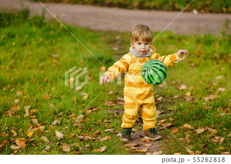 Happybaby boy laughing and playing with green ball Happybaby boy laughing and playing with green ball 55262818