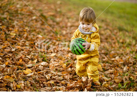 Happybaby boy laughing and playing with green ball Happybaby boy laughing and playing with green ball 55262821