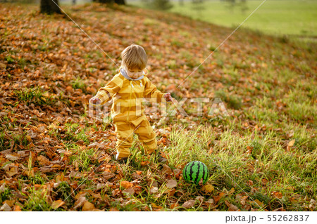 Happybaby boy laughing and playing with green ball 55262837